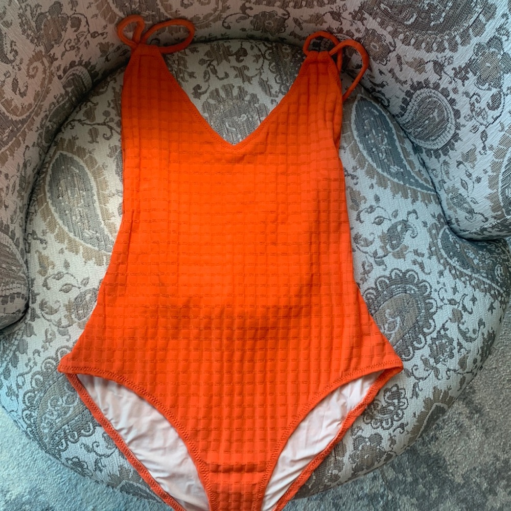 Orange one piece. NWT